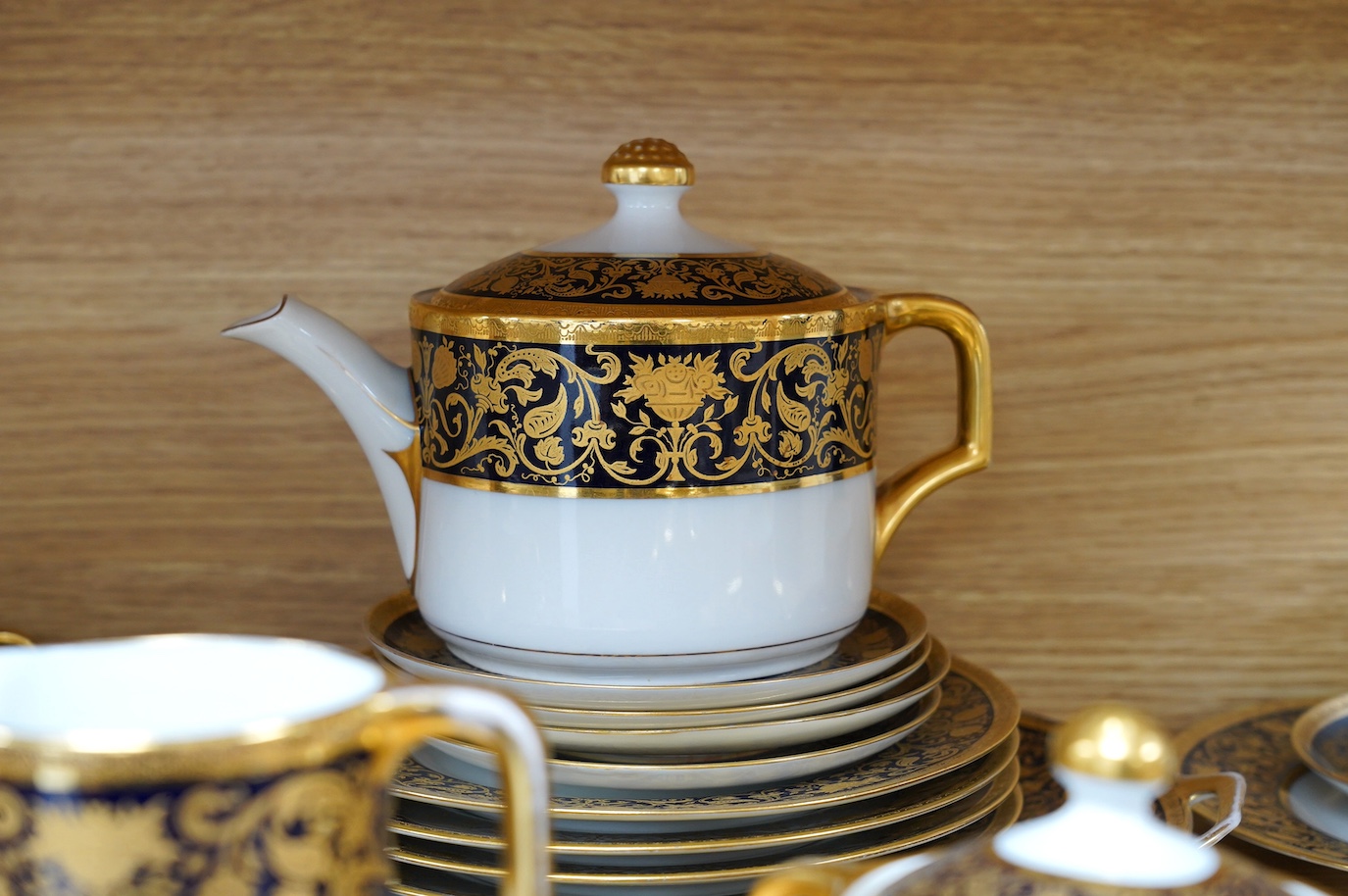 A Comte Harrach, Karlsbad, Bavarian rich dark blue and gilt banded part tea set, largest 32cm wide. Condition - fair to good